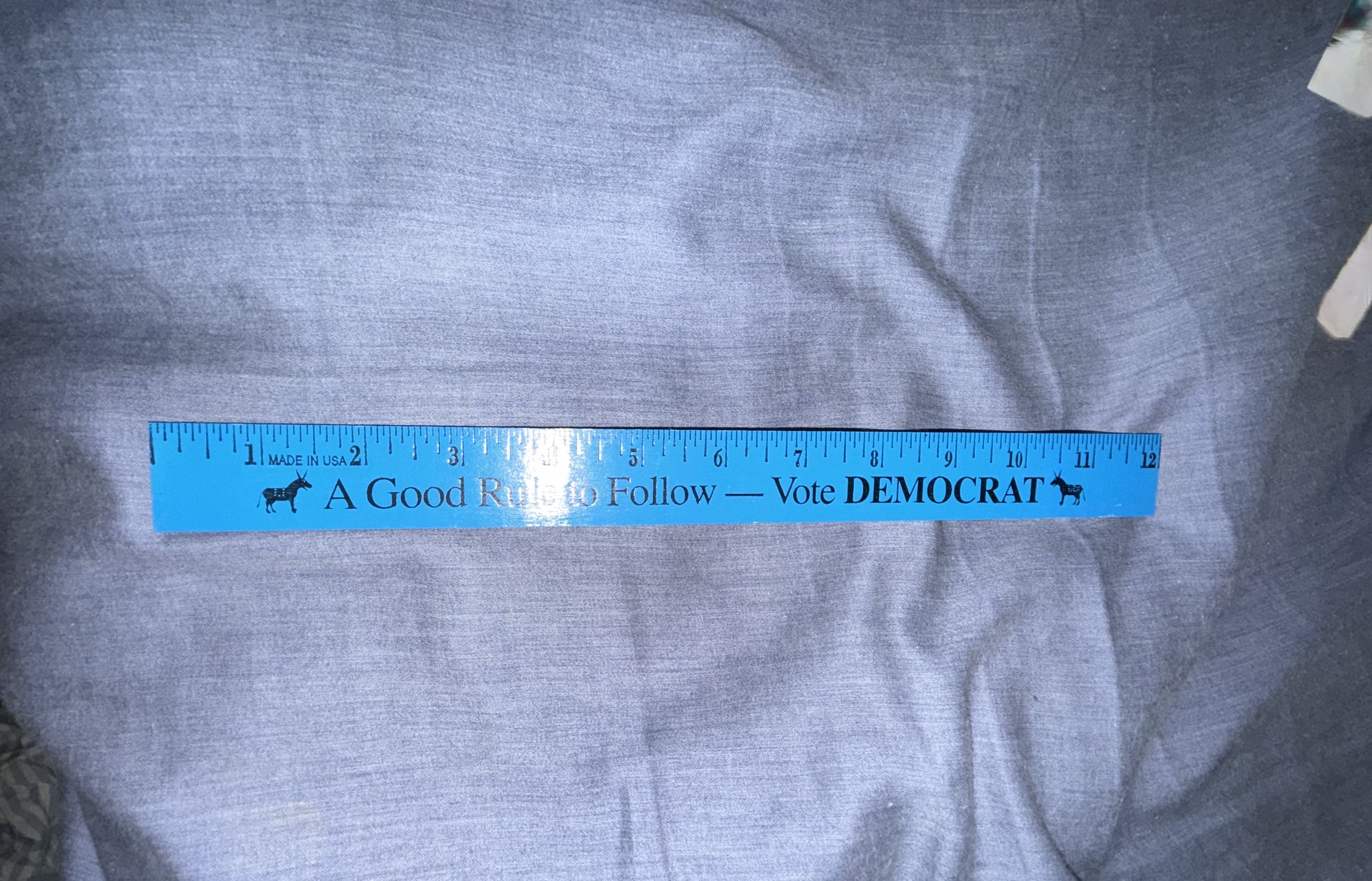 Plastic ruler with Democratic Party political slogan "A Good Rule to Follow — Vote DEMOCRAT"