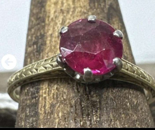 Vintage gold and platinum ring with round ruby solitaire and engraved shoulders