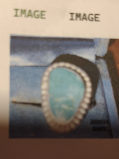 Sterling silver ring with turquoise stone in rope bezel setting