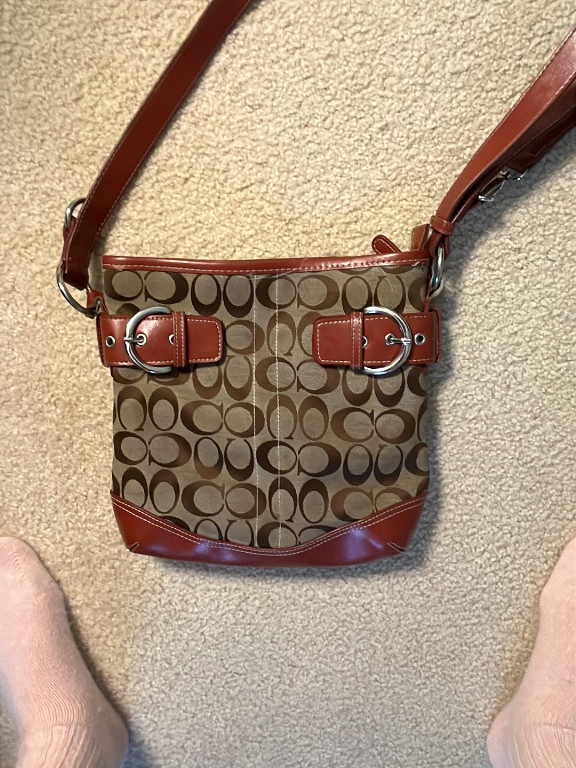 Canvas and leather Coach Signature crossbody bag with buckle detail