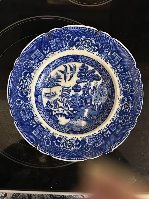 Blue and white porcelain soup bowl with 'Blue Willow' pattern