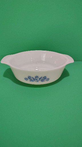 Milk glass oval casserole dish with blue cornflower pattern by Anchor Hocking Fire King