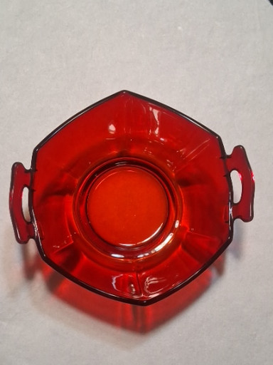 Ruby red glass bon-bon dish with handles, likely by Anchor Hocking or New Martinsville