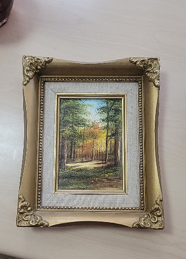 Oil painting on canvas titled 'Landscape with Trees and Water' in ornate gilt frame, artist signature illegible