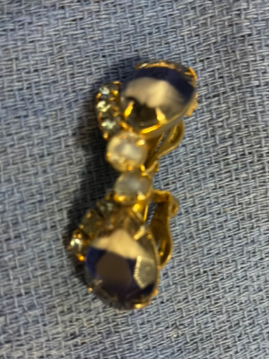 Vintage gold-tone metal earrings with amber-colored glass or crystal stones
