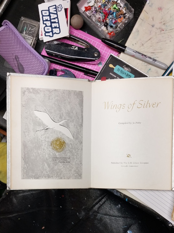 Hardcover book titled 'Wings of Silver' compiled by Jo Petty