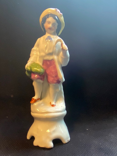 Porselein beeldje van een jongen met een eend