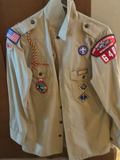 Vintage Boy Scouts of America (BSA) uniform shirt with patches and insignia