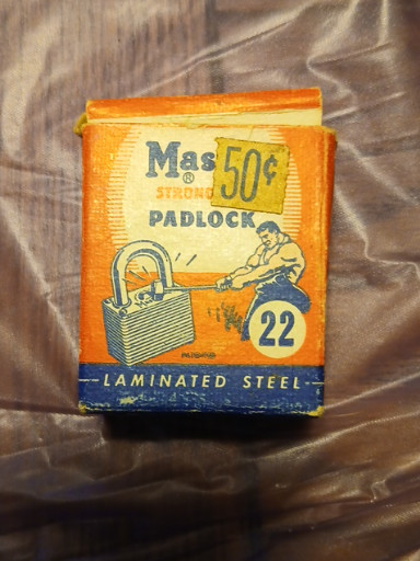 Vintage Master Lock No. 22 'Strong Boy' laminated steel padlock in original packaging with unused lock inside