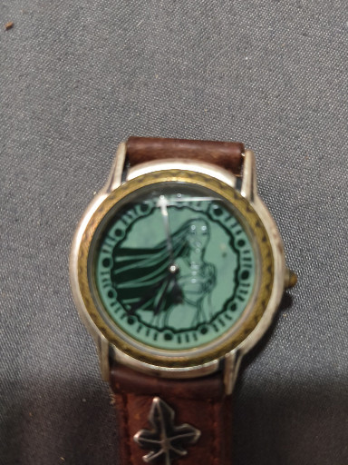 Vintage Fossil Disney Pocahontas wristwatch model DS-167 with leather band featuring leaf embellishment
