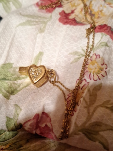 Gold-tone metal heart-shaped whistle pendant necklace with clear rhinestones