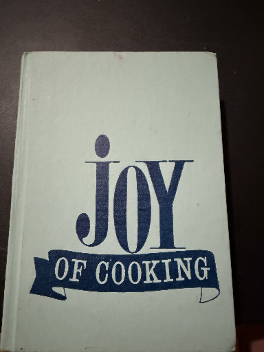 Hardcover cookbook titled 'Joy of Cooking' by Irma S. Rombauer and Marion Rombauer Becker