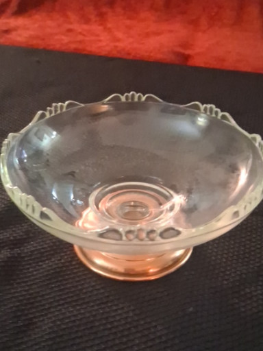 Clear glass compote dish with detachable copper-tone base, likely by Princess House