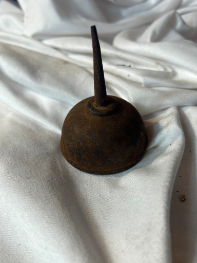 Vintage metal thumb-pump oil can with long spout