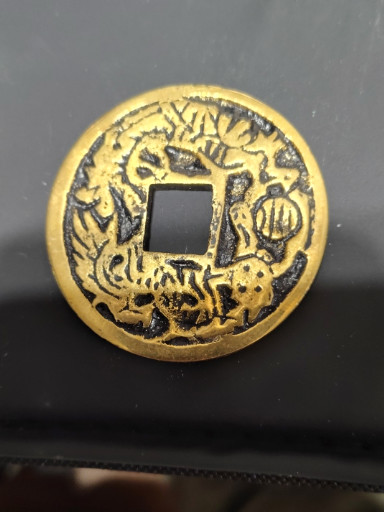Bronze gilt Chinese coin with dragon, phoenix, turtle, and tiger motifs