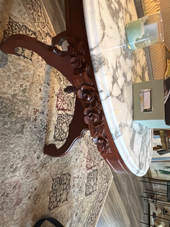 Carved wood console table with white marble top