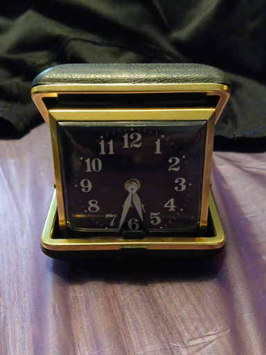 Vintage folding travel alarm clock with clamshell case