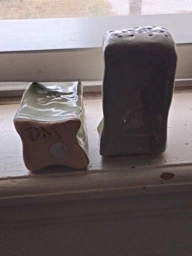 Ceramic salt and pepper shaker set with metallic brown glaze