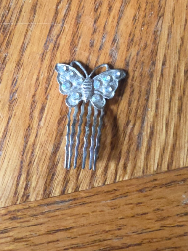 Metal hair comb with butterfly decoration