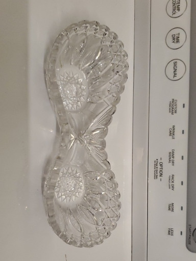 Pressed glass relish dish with pinwheel and floral motifs