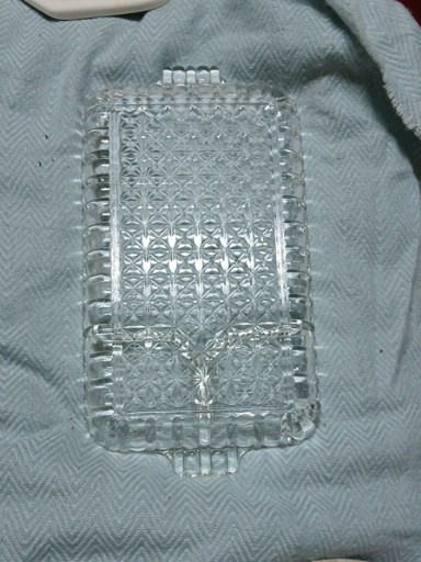 Pressed glass snack tray with starburst pattern, likely Anchor Hocking or Hazel Atlas