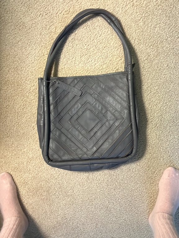 Leather shoulder bag by Lost & Found with geometric patchwork design