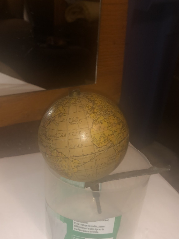 Vintage terrestrial globe on stand, early 20th century