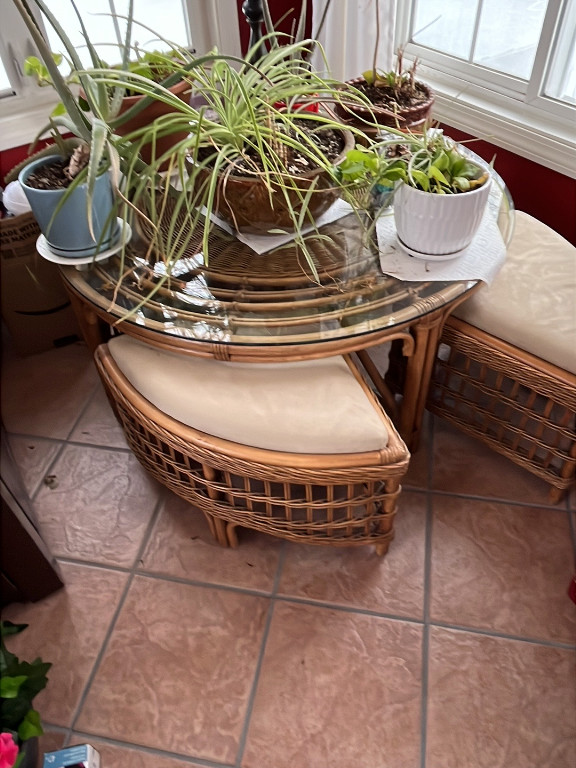 Rattan and glass coffee table with four nesting stools