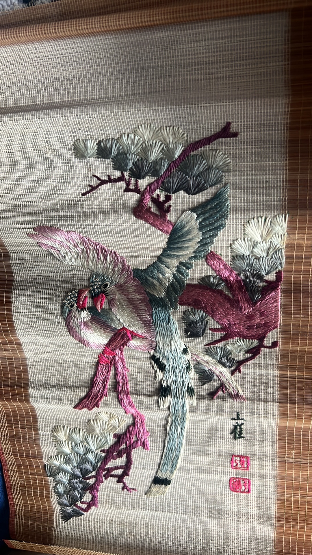 Silk embroidery artwork depicting birds and pine branches