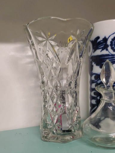 Pressed glass vase with starburst and floral pattern