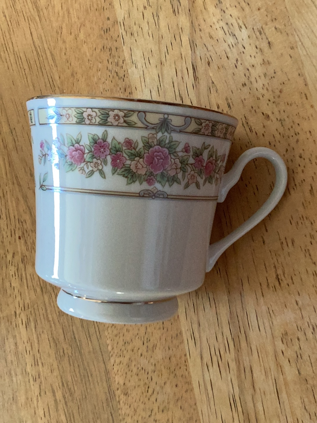 Porcelain teacup with floral pattern by Sango, "Trianon" pattern