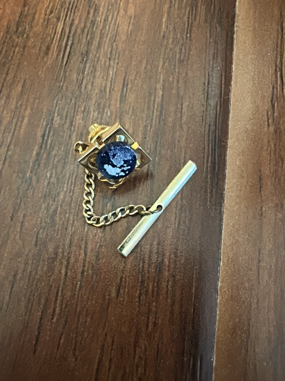 Gold-tone tie tack with blue sodalite stone and chain
