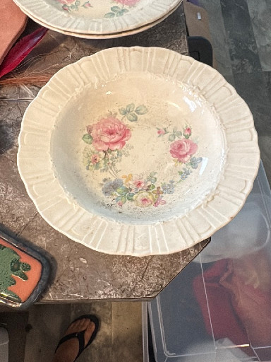 Ceramic serving bowl with floral transfer decoration and embossed rim