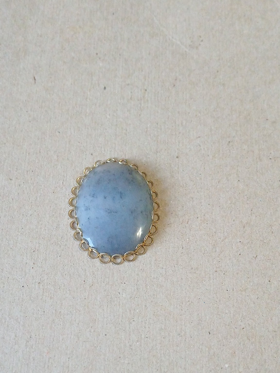 Sterling silver pendant with blue Angelite gemstone in oval filigree setting