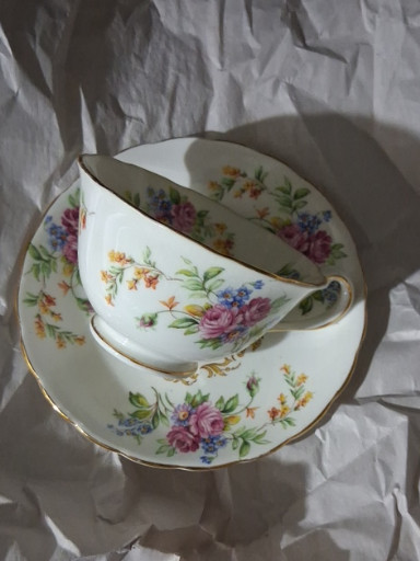 Fine bone china teacup and saucer with floral pattern by Royal Chelsea