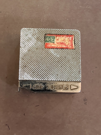 Metal mesh tape measure with vintage packaging