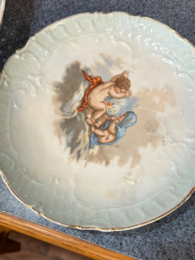 Porcelain plate with cherub decoration, circa 1900, likely East Palestine Pottery