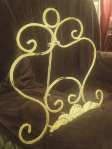 White painted cast iron music stand with decorative scrollwork