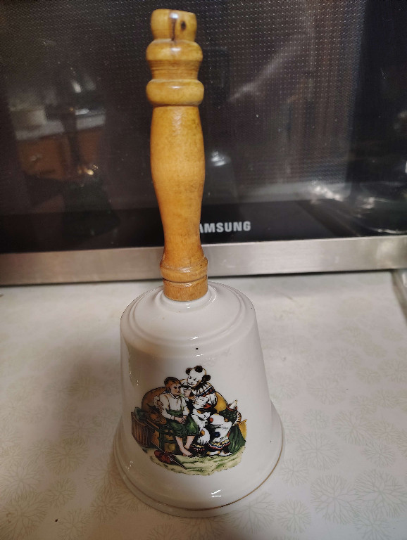 Porcelain bell titled 'The Runaway' from Norman Rockwell's Clown Series