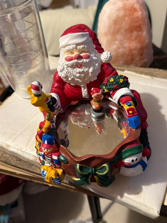 Christmas Santa Claus figurine tea light candle holder with toys and presents
