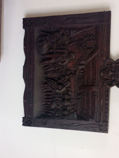 Carved wooden relief panel depicting dragons, likely Chinese or Southeast Asian origin