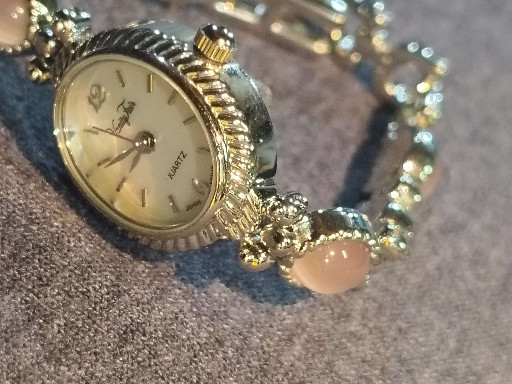 Quartz ladies' watch with decorative slide charm bracelet by Vanity Fair