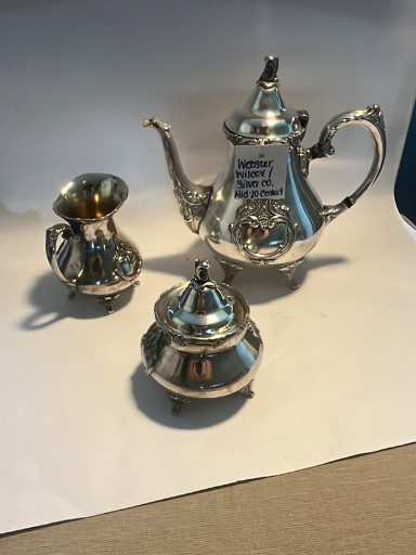 Silver-plated tea service set with ornate grape and vine decoration by Webster Wilcox