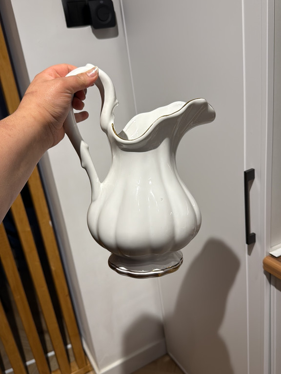 White porcelain pitcher with gold trim