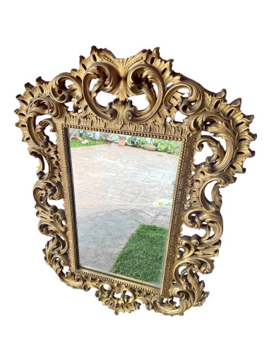 Gilt wood ornate wall mirror with Rococo-style carved frame