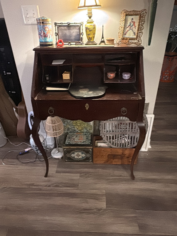 Victorian-style oak slant-front secretary desk with serpentine front and cabriole legs