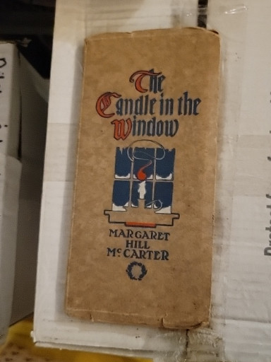 First edition book titled 'The Candle in the Window' by Margaret Hill McCarter