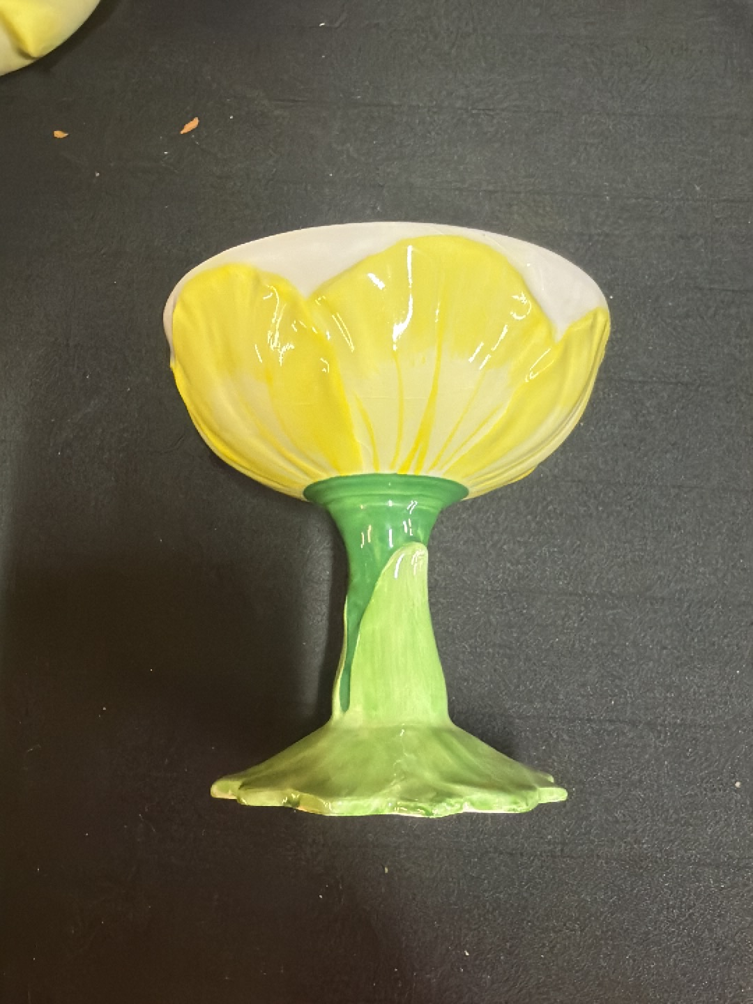 Ceramic flower-shaped compote dish with yellow petals and green stem
