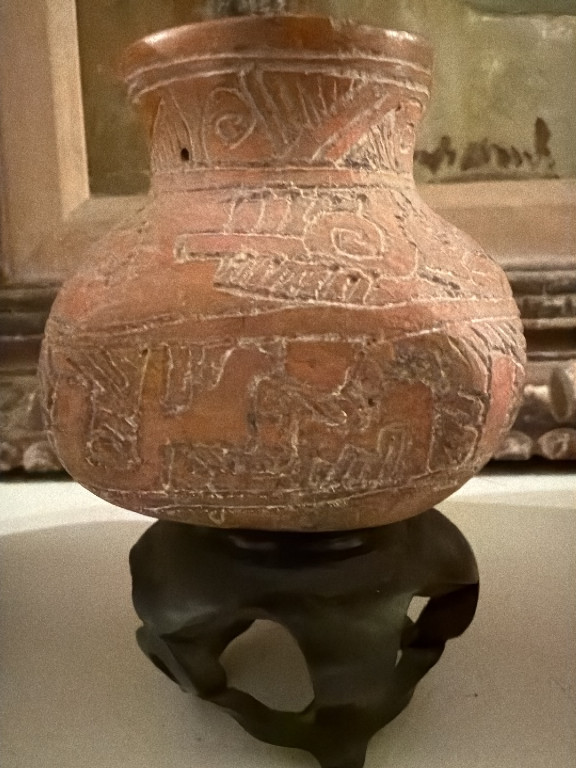 Terracotta pottery vessel with incised zoomorphic and geometric motifs in Pre-Columbian Mesoamerican style