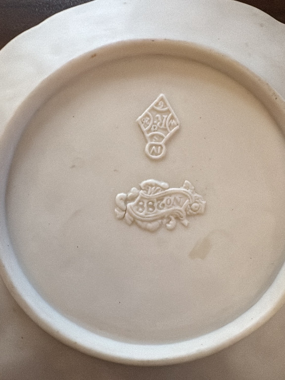 Ceramic plate or dish base with impressed maker's mark by E.J.D. Bodley